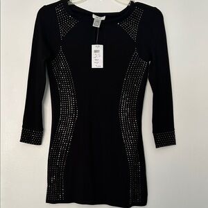 Black long sleeve shirt with beautiful beading along the front and sleeves.